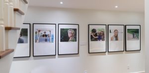 family photos displayed in hallway