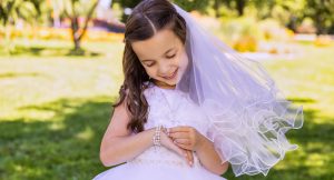 young girl dressed for first communion